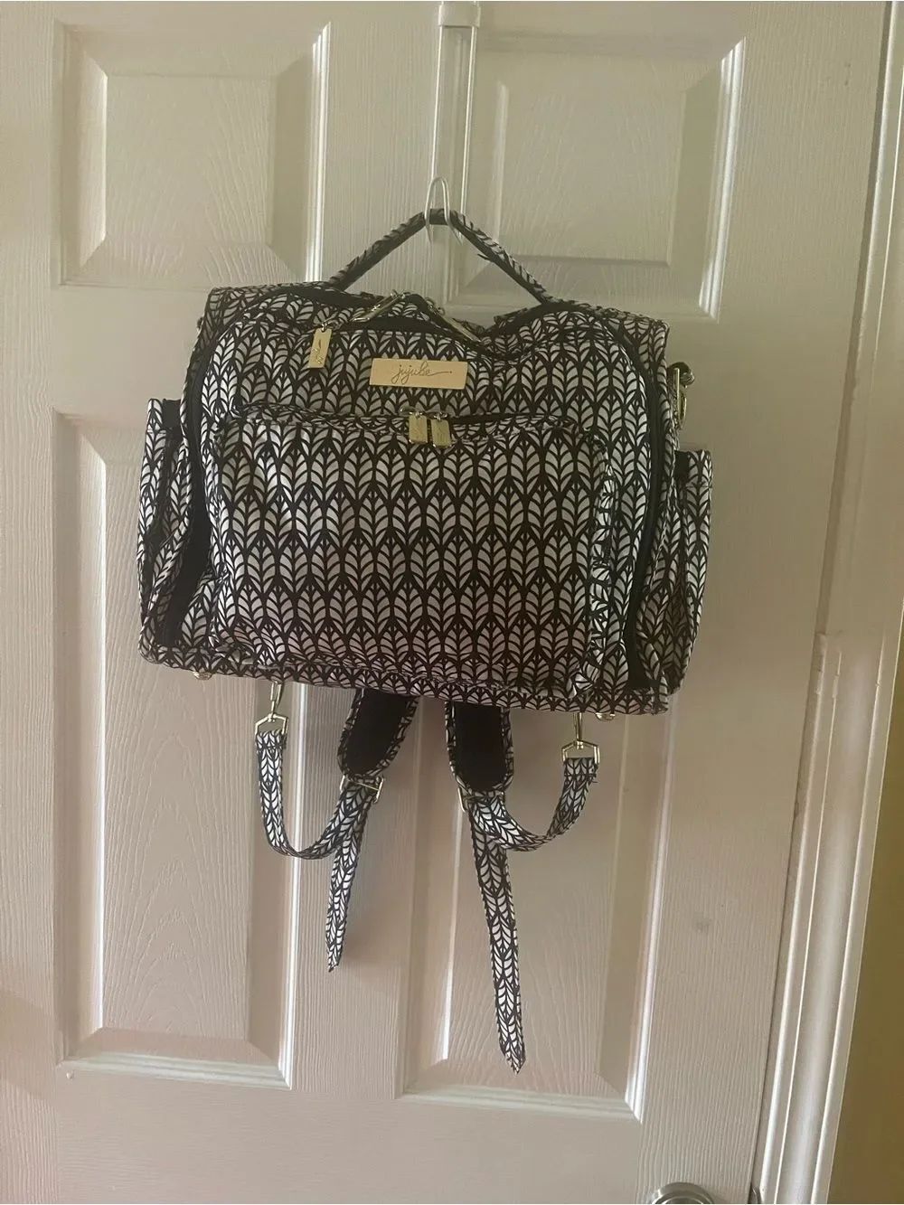 Ju-Ju-Be Black & White Pattern Convertible Baby Backpack with changing pad .